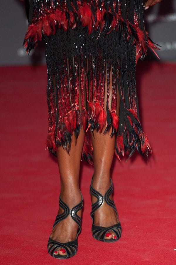 Naomi Campbell's dress with gorgeous red-and-black feather detailing on its hem
