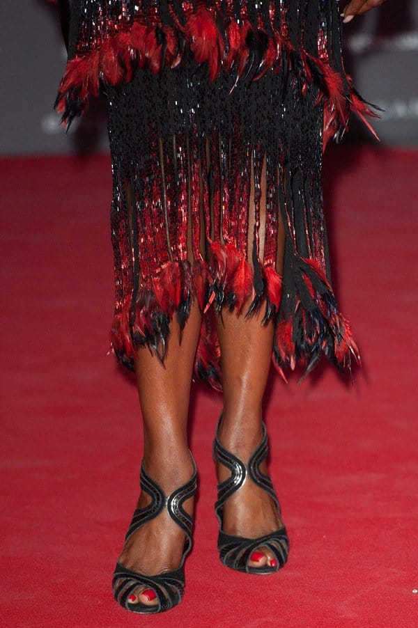 Naomi Campbell's dress with gorgeous red-and-black feather detailing on its hem