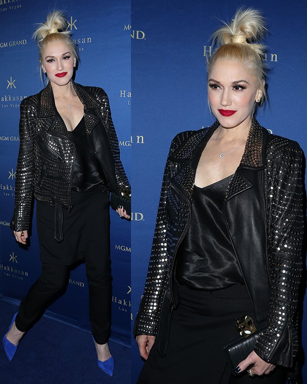 Gwen Stefani wearing a black A.L.C. Blake jacket, Kelly Wearstler pleated clutch, and blue L.A.M.B. Faith suede stilettos