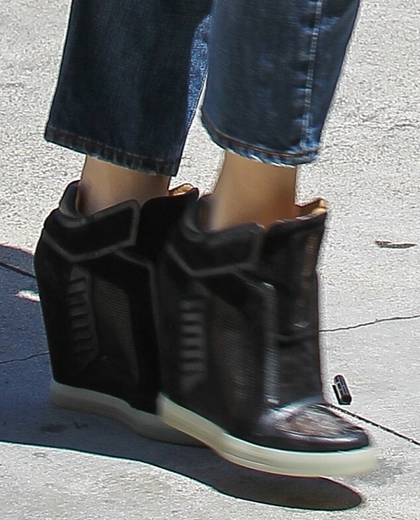 Gwen Stefani in wedge sneakers from her own footwear label L.A.M.B.