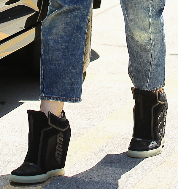Gwen Stefani wearing L.A.M.B. "Freeda" wedge sneakers