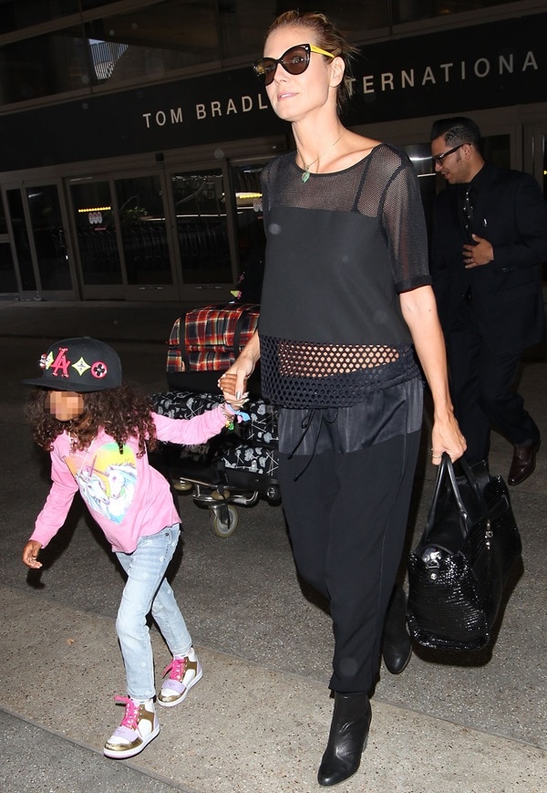 Heidi Klum and daughter Lou Samuel arriving at Los Angeles International Airport (LAX) on May 10, 2014