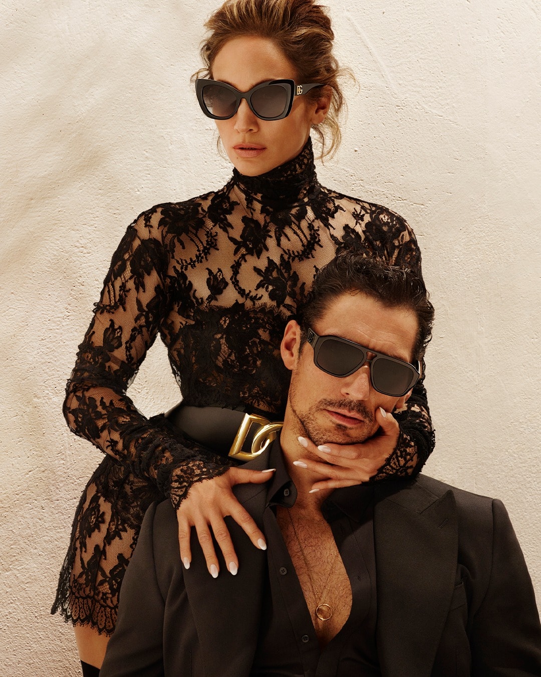 Jennifer Lopez posing with English male fashion model David James Gandy in Dolce & Gabbana’s Spring 2022 eyewear campaign