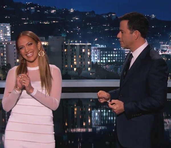 Jennifer Lopez shares a laugh with Jimmy Kimmel during her appearance on Jimmy Kimmel Live, where she dazzled in a figure-hugging white dress