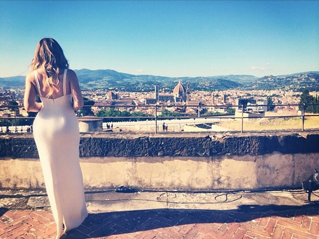 Khloé Kardashian's Instagram post celebrating Kim and Kanye's wedding with the caption 'E vissero felici e contenti...' (And they lived happily ever after...).