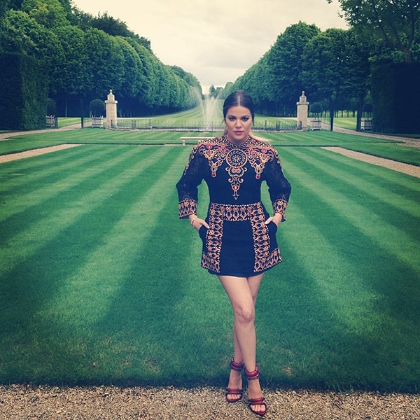 Khloé Kardashian posing in the Chateau de Wideville's gardens