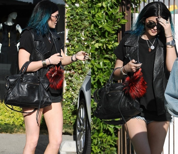16-year-old Kylie Jenner revisited the Andy LeCompte salon in Los Angeles, turning heads with her new vibrant blue-green hair color