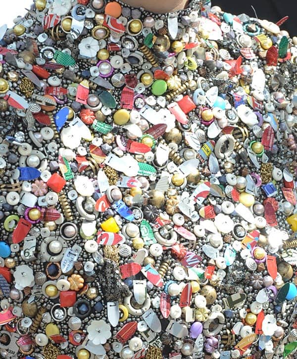 Close-up of the intricate beadwork on Marion Cotillard's Maison Martin Margiela dress, featuring a variety of colorful beads, nuts, and bolts