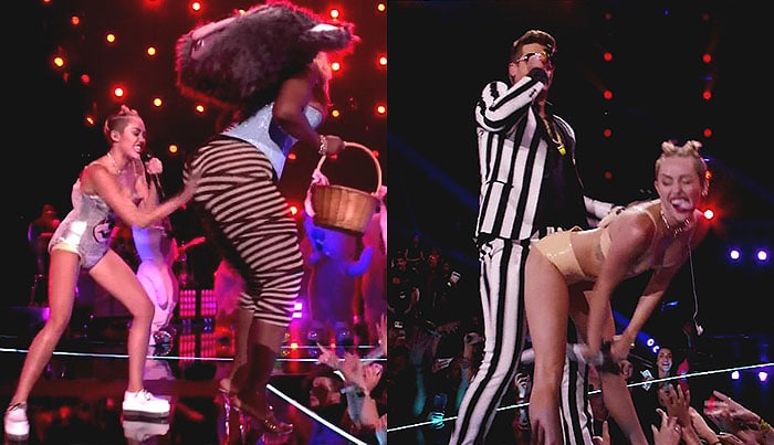 Miley Cyrus slapping a dancer's booty and twerking against Robin Thicke at the 2013 MTV Video Music Awards held at the Barclays Center in Brooklyn, New York, on August 25, 2013