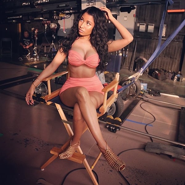Nicki Minaj wearing a Norma Kamali swimsuit for the Myx Fusions Moscato beverage commercial