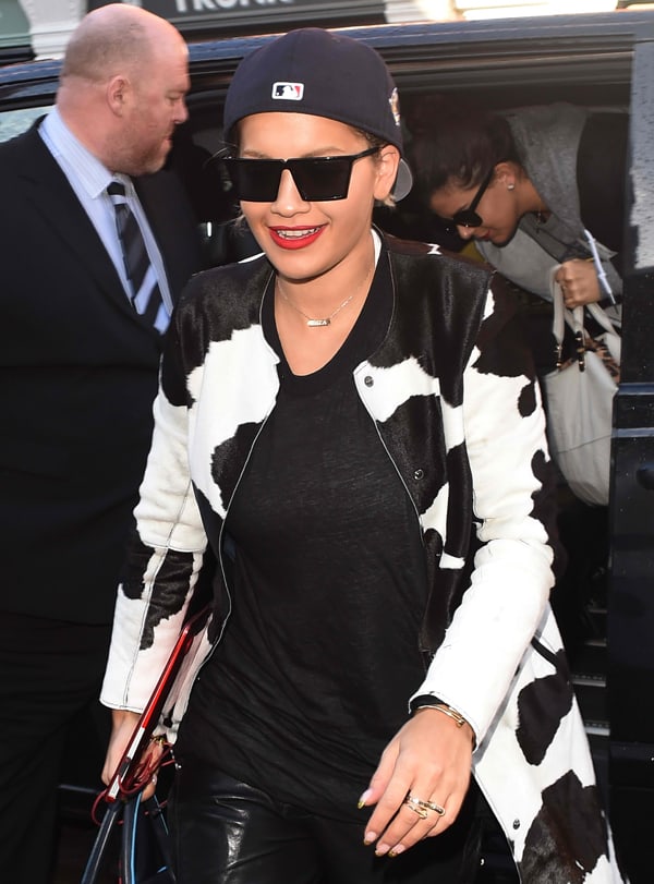 Rita Ora in a Givenchy cow print coat and black sweatshirt