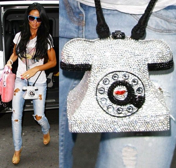 Katie Price with a crystal telephone handbag