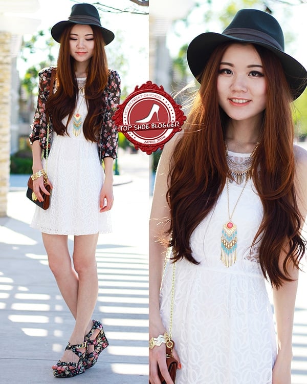 Yuzi flaunts her legs in a summery white dress
