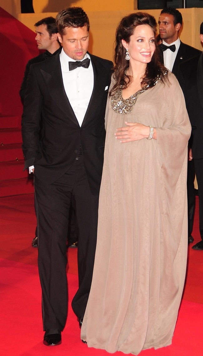 Angelina Jolie wears a jeweled kaftan to hide her baby bump as she attends the premiere of Changeling during the Cannes Film Festival in France on May 20, 2008