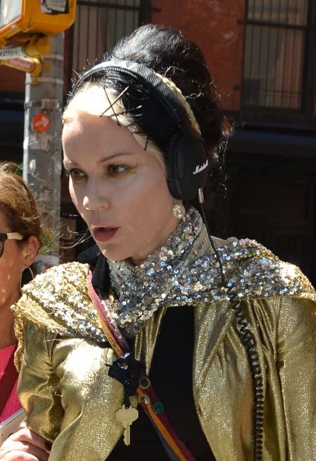 Daphne Guinness elegantly adorned with a dazzling sequined scarf