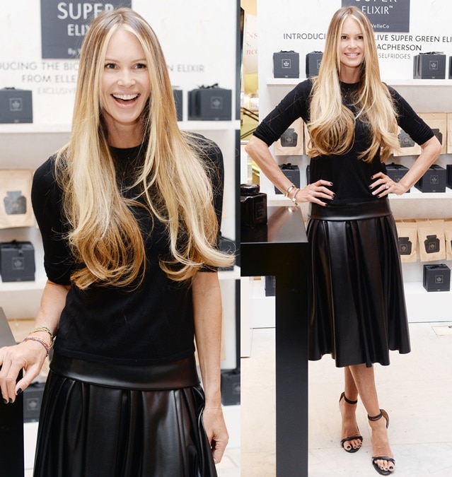 Elle Macpherson paired a pleated leather midiskirt with a leather-trimmed sweater