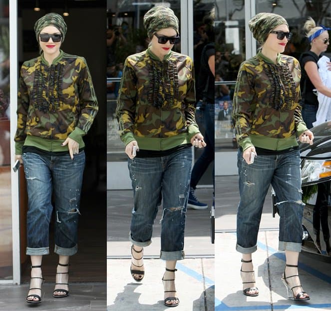 Gwen Stefani wears a camo jacket and a matching beanie while exiting a nail salon in West Hollywood