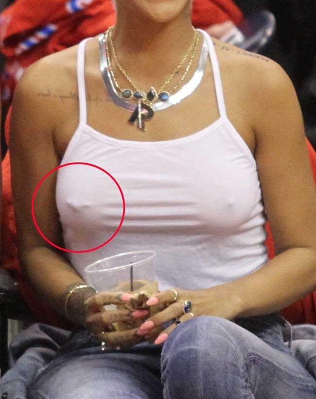 Rihanna's nipples in a skimpy white cropped tank top