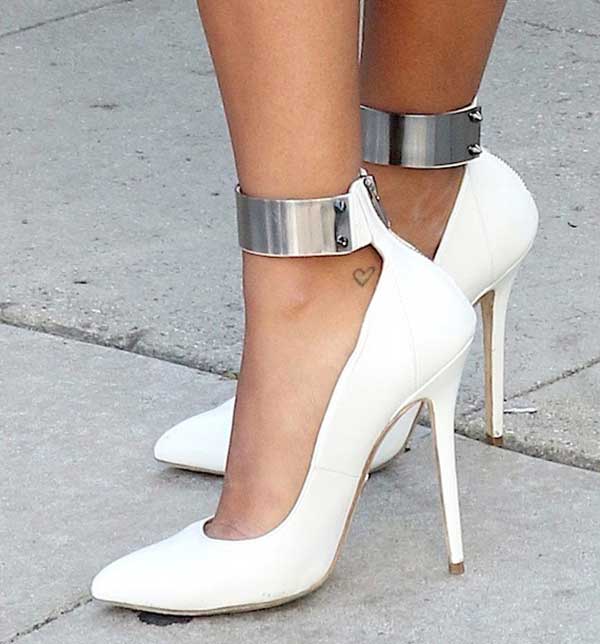 Angela Simmons wearing Olcay Gulsen pumps