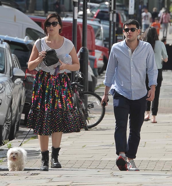 Daisy Lowe walking her dog Monty in Primrose Hill with a male companion in London