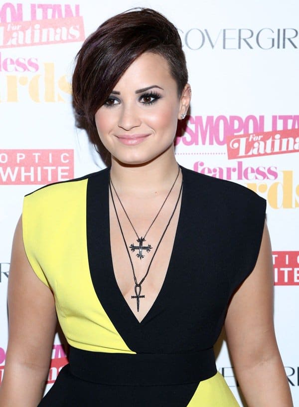 Demi Lovato showcases a chic and edgy look in a Fausto Puglisi dress and layered necklaces