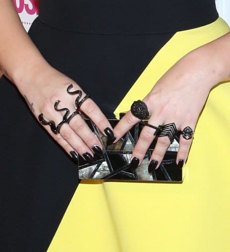 Demi Lovato flaunts her gothic-inspired black rings and chic clutch
