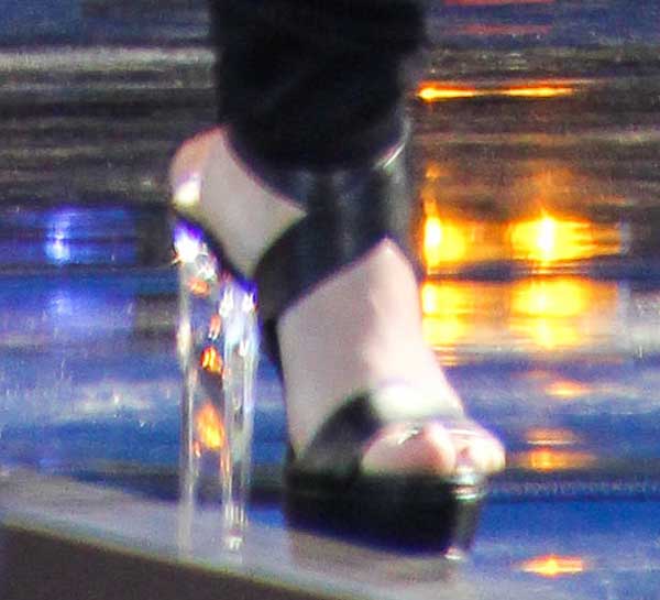 Demi Lovato's Ruthie Davis 'Naomi' sandals featuring bold crisscross straps and striking Lucite heels