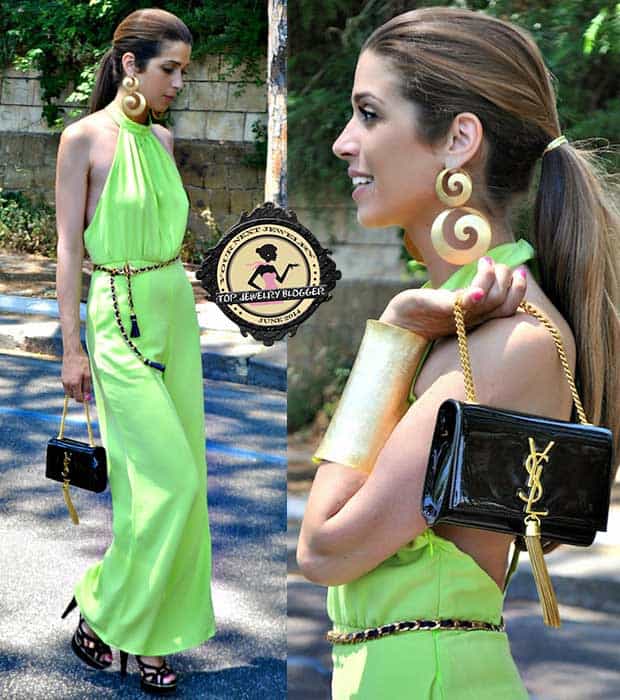 Italian fashion blogger Fabrizia Spinelli styled her green jumpsuit with spiral earrings and an oversized cuff