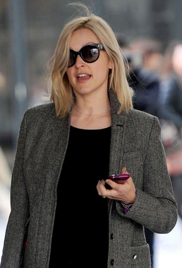 Fearne Cotton styled her coat with a crisp white button-down shirt and a modern laminated skirt