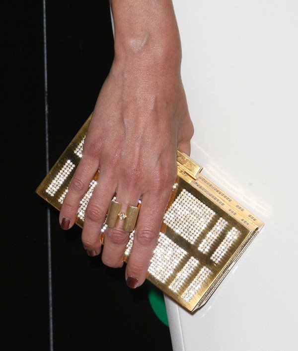 Giuliana Rancic complements her look with a matching gold-embellished box clutch at the 2014 Daytime Emmy Awards