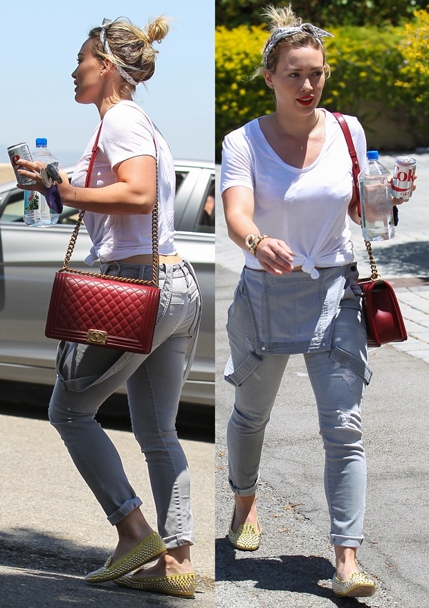 Hilary Duff dressed in 1940s style with dungarees, head scarf, and bright red lipstick on her way to a private acting class