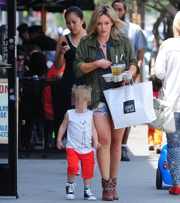 Hilary Duff, with iced tea in hand, and son Luca, holding his Chupa Chups lollipop, leaving Joan's on Third in Los Angeles