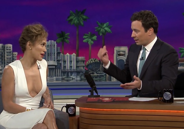 Jennifer Lopez discusses her World Cup performance with Jimmy Fallon on 'The Tonight Show' while stunning in a white Solace London dress
