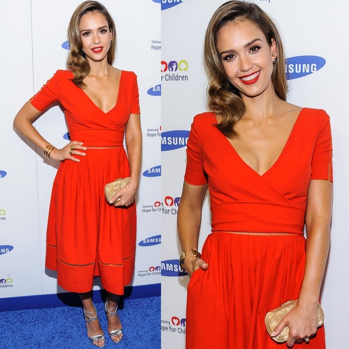 Jessica Alba wearing Jill Golden jewelry and Brian Atwood sandals and carrying a Corto Moltedo clutch with her Preen dress