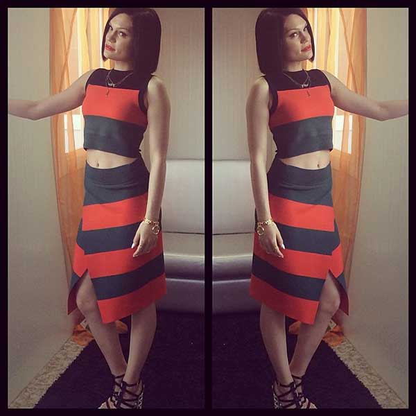 Embrace effortless style by pairing a striped crop top with a matching wrap skirt and strappy heels for a modern, chic look inspired by Jessie J