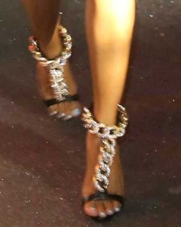 Karrueche Tran's white pedicure highlights her feet while her Giuseppe Zanotti heels, with chain-embellished straps, add both height and elegance to her overall look