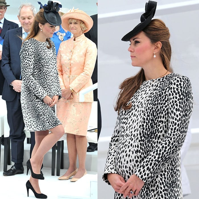 Kate Middleton dazzled at the Princess Cruises Naming Ceremony on June 13, 2013, wearing a Hobbs Dalmatian Mac coat, Sylvia Fletcher hat, Annoushka pearl drop earrings, Episode Angel pumps, and her iconic Garrard sapphire engagement ring