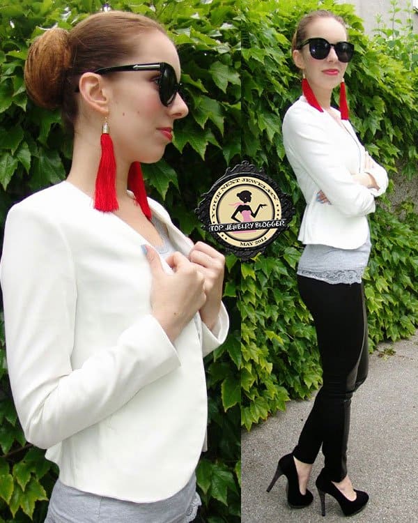 Katja added color to her monochrome outfit with red tassel earrings