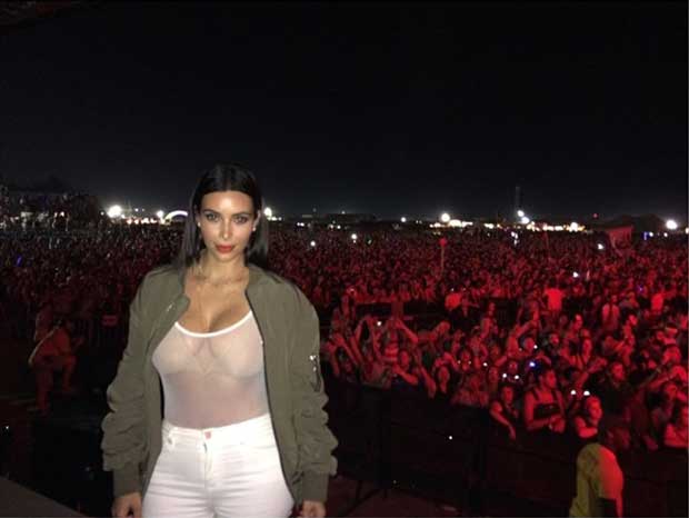 Kim Kardashian rocks an Acne Studios Encore bomber jacket at the 2014 Bonnaroo Music and Arts Festival