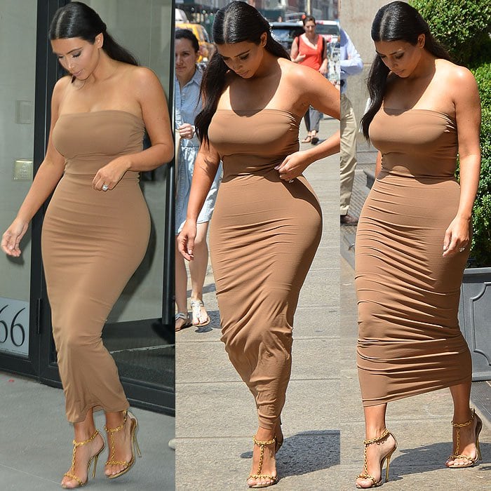 Kim Kardashian constantly checking her appearance and adjusting the shapewear underneath her dress