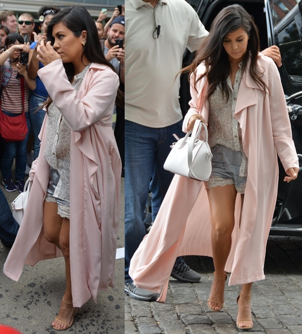 Kourtney Kardashian flaunts her legs in a soft pink trench coat