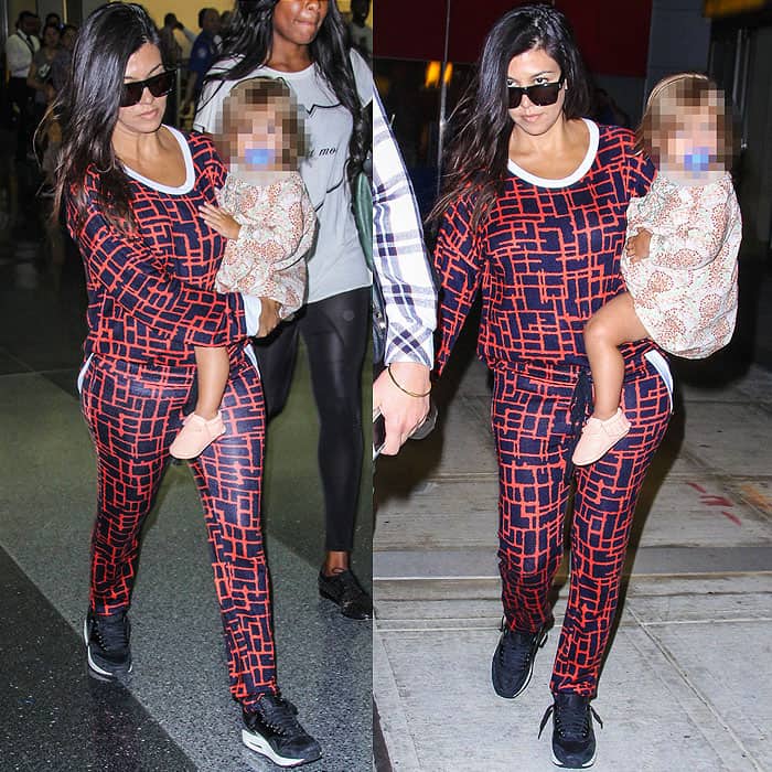 Kourtney Kardashian rocks a Michael Lauren Clemen pullover and matching Chet track pants