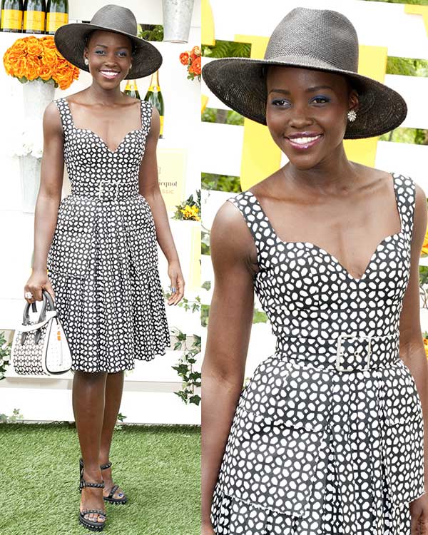 Lupita Nyong’o stuns with flawless makeup, sparkling jewelry, and a stylish Janessa Leone Rita Panama hat
