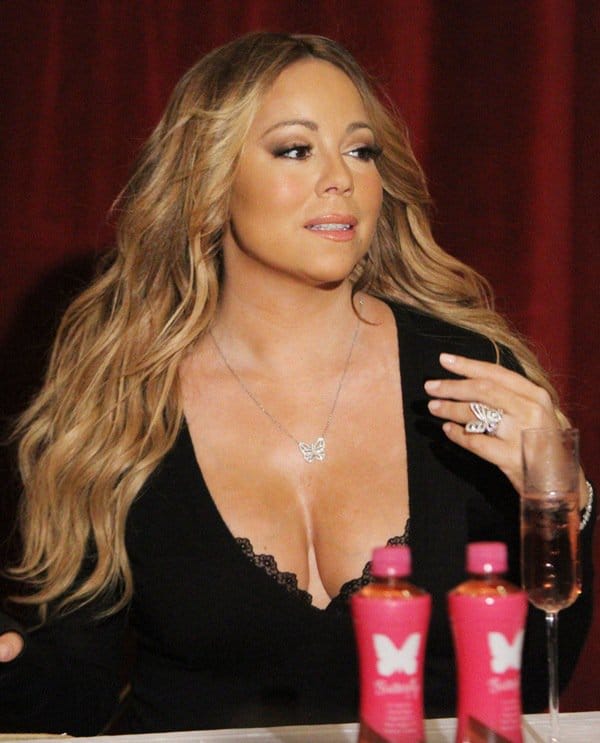 Mariah Carey wears butterfly jewelry to the launch of “a melodic beverage inspired by the magic of Mariah Carey”