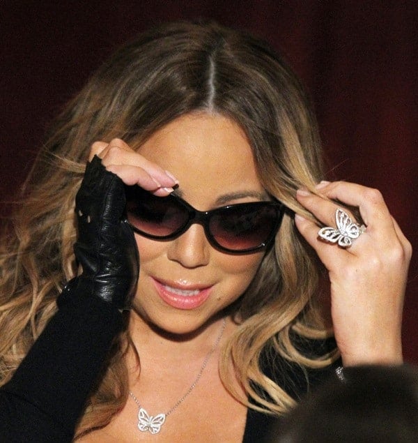 Mariah Carey wore a butterfly necklace with a matching ring