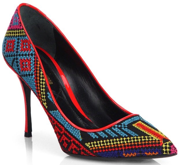 These stunning pumps feature intricate Mexican-inspired embroidery in vibrant colors, a sleek pointed toe, and a bold red trim for a striking, culturally rich design