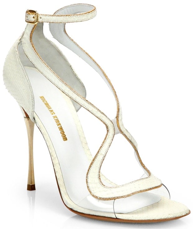 These elegant sandals feature a sculptural white python strap design, a translucent detail for modern sophistication, and a sleek stiletto heel for a glamorous finish