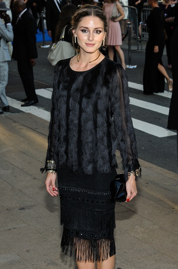 Olivia Palermo graced the red carpet at the 2014 CFDA Fashion Awards and made a fashion statement in a fur and fringed dress by Ann Taylor