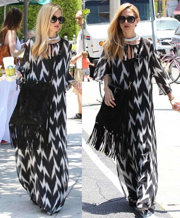 Rachel Zoe rocks a boho-chic look in a black-and-white maxi dress, paired with a statement gold choker, round black sunglasses, and a fringe Gucci shopper bag at Brentwood Country Mart
