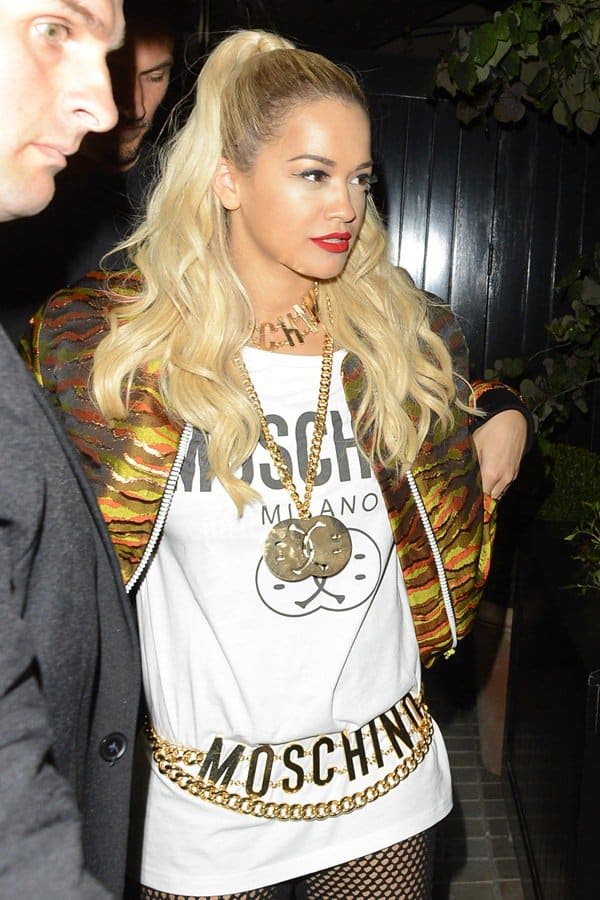Rita Ora opted to cover up with a big Moschino tee and a multicolored camo jacket by House of Holland